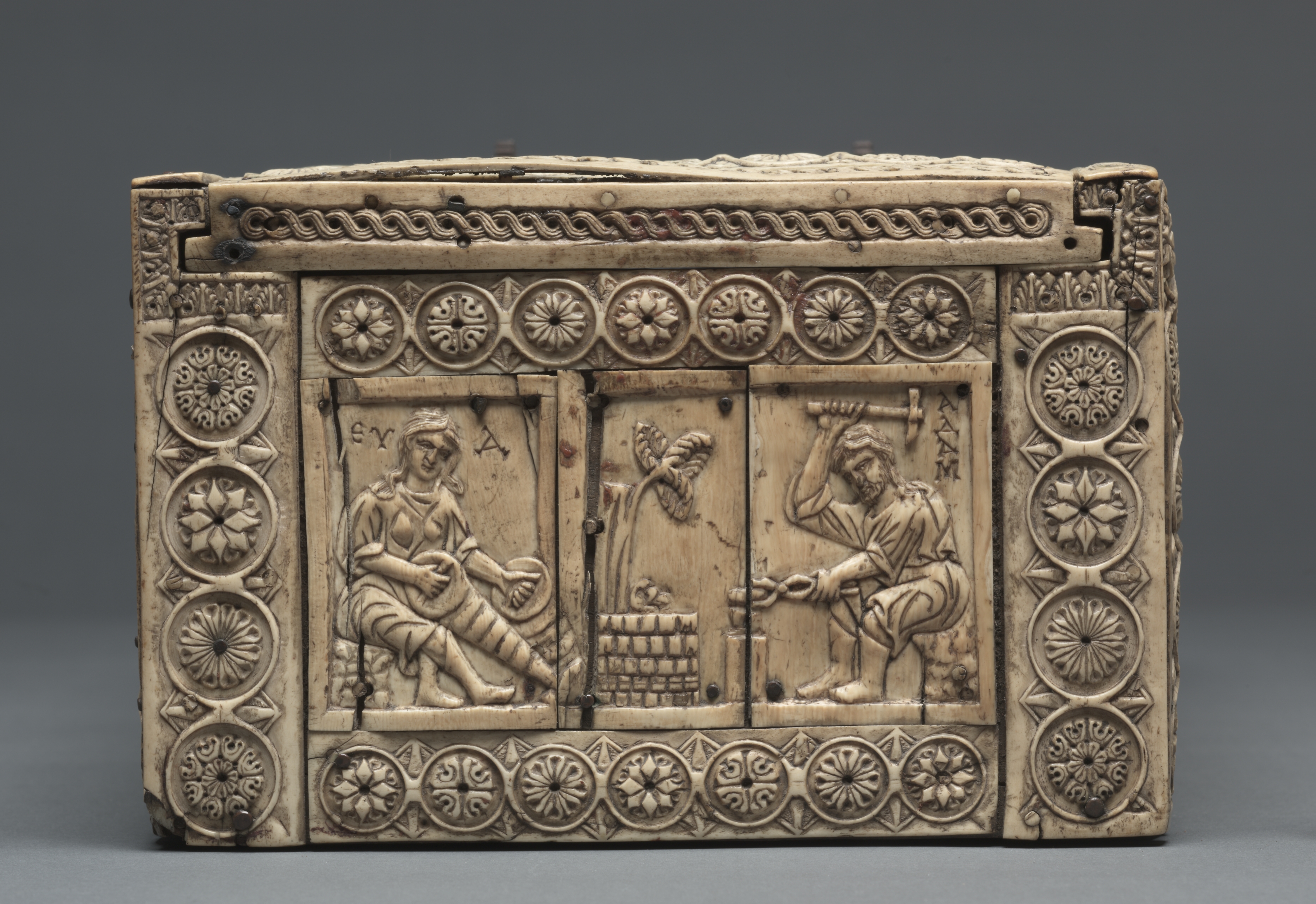 Adam and Eve blacksmithing (Cleveland casket)